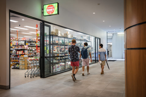 Front entrance to Davely's Asian Supermarket in Brisbane City with two pedestrians walking through the mall