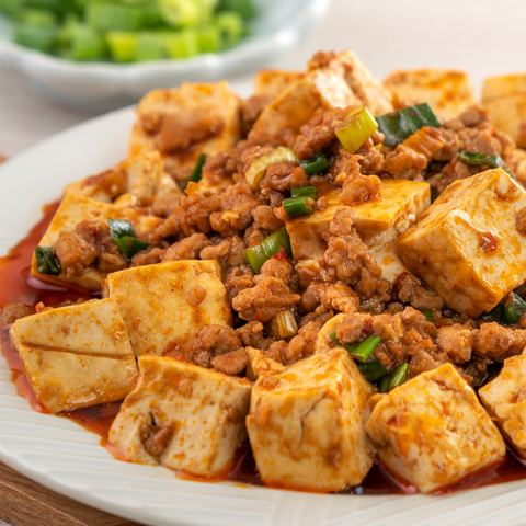 Mapo Tofu is pork mince stir fried with cubes of tofu with a spicy bean sauce base
