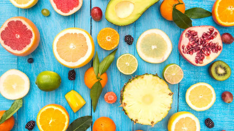 Cut healthy fruit snacks on a blue backdrop