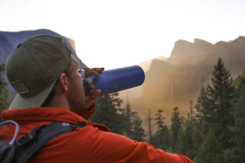 man drinking fom a Healthy Human water bottle in Yosemite