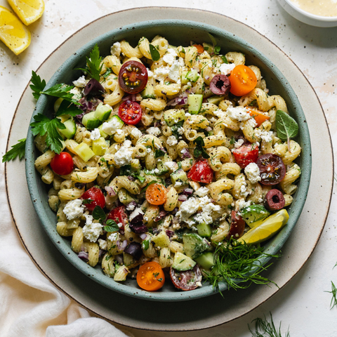 Greek Tahini Pasta Salad is tangy, fresh, and herbaceous. It’s tossed with an incredibly delicious creamy tahini red wine vinaigrette, which ties all of the flavors together perfectly! Customize to fit the tastes of any of your potluck guests.