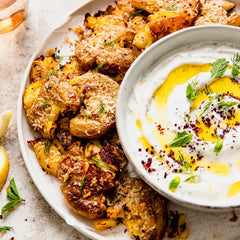 Crispy Parm Smashed Potatoes with Garlic Yogurt Tahini Dip