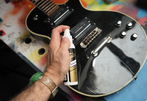 polishing a guitar body with gibson guitar polish