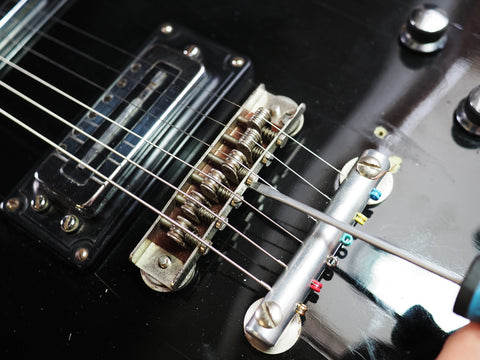 adjusting a guitar's intonation