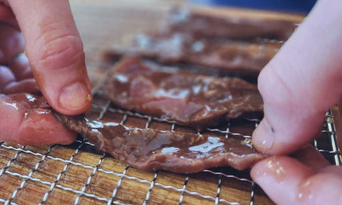 Jerky on stainless steel trays