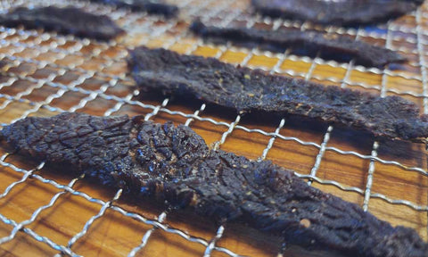 Beef jerky on dehydrator trays