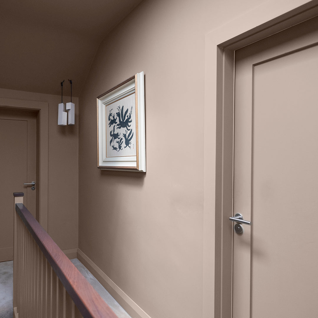 Mid neutral toned hallway colour drenched in Motte and Bailey by Curator Paints