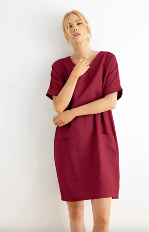 woman wearing a red linen nap dress with pockets