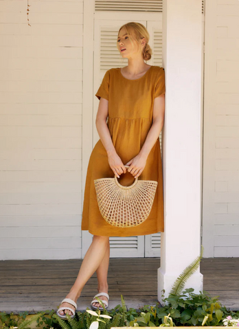 Woman wearing her linen nap dress getting ready to run her errands