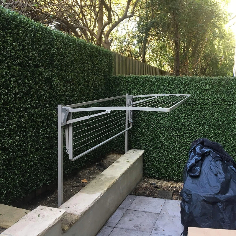 Natural Boxwood Panels in a backyard area of an apartment block