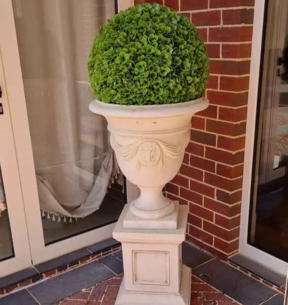 faux topiary ball in a planter from past client