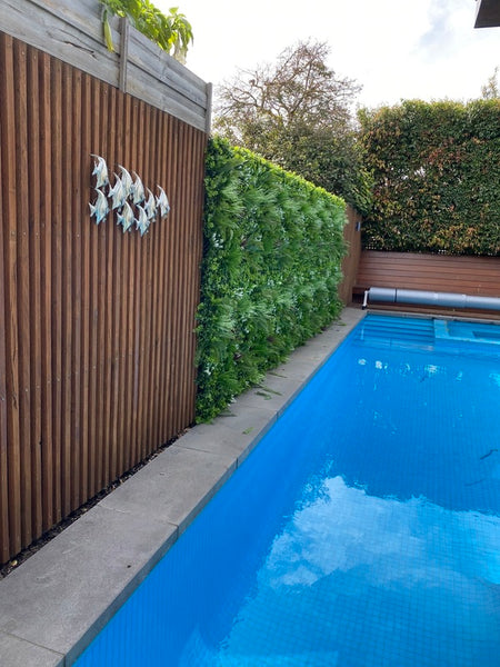perfectly fixed fake vertical garden on pool