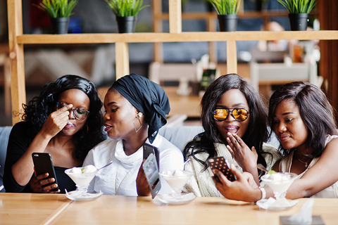 african women checking social media