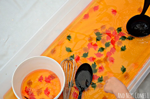 fall sensory water play in mud kitchen sensory bin 