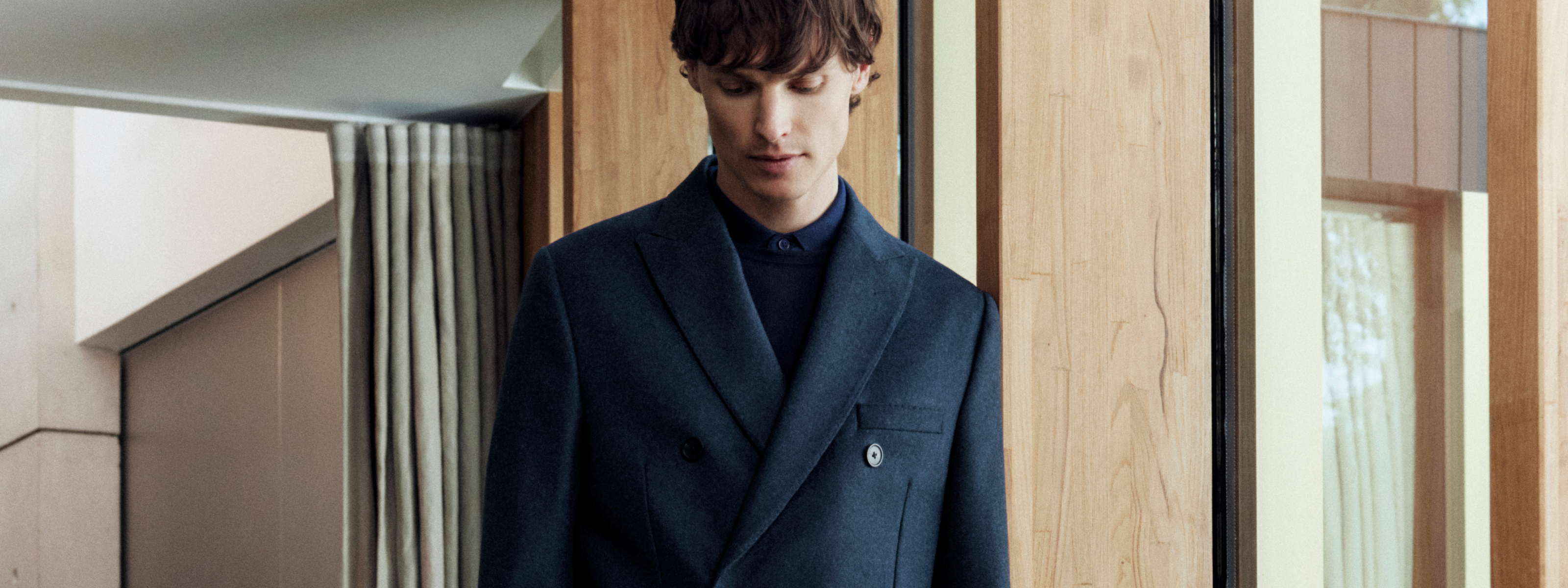 A man wearing Seymour Overcoat in Blue Barberis Wool