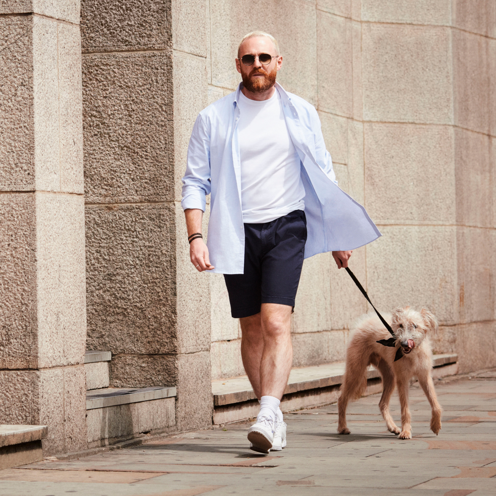 Man taking a stroll with his dog