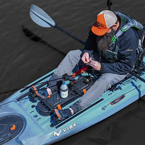 Angler tying on new fishing lure