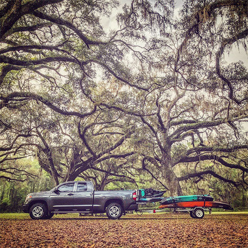 Toyota Tundra pulling trailer with Vibe Kayaks