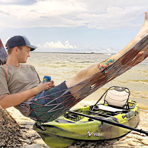 Lounging in a hammock with Vibe yellowfin 100 in the background