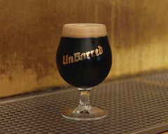 Branded Unbarred glass containing stout
