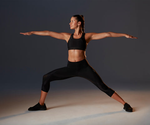 female athlete doing a yoga pose in endurance generator 3/4 tights