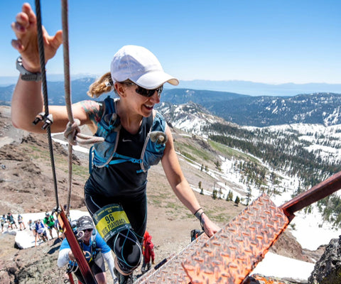 female athlete doing a winter hike and mountain climb