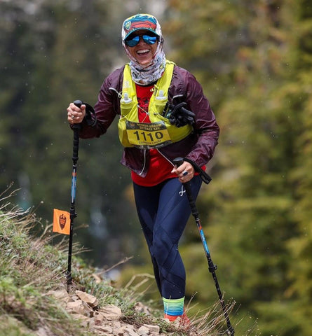 female hiking in the winter wearing endurance generator insulator tights