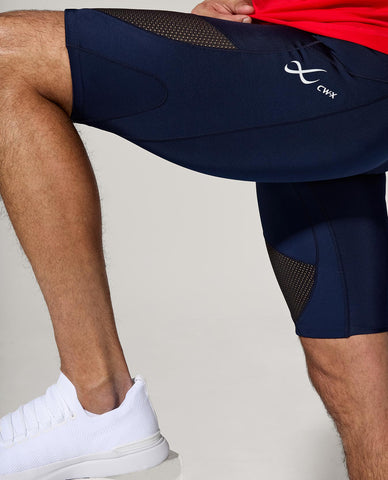 male athlete showing detail of stabilyx ventilator shorts in true navy