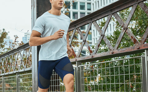 male athlete running wearing CW-X compression shorts model Stabilyx Ventilator