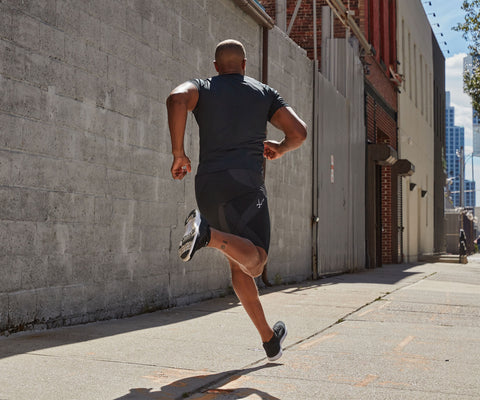 male athlete training for a marathon running in endurance generator shorts