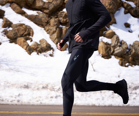 male athlete running wearing endurance generator insulator tights