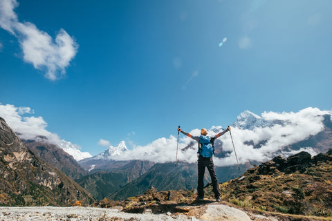 male hiking with layering clothes over base layer