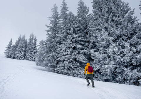 hiker in the mountains wearing compression tights under winter gear