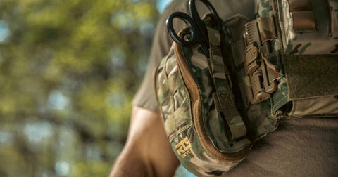 A multicam rapid deploy IFAK pouch attached to a multicam plate carrier.