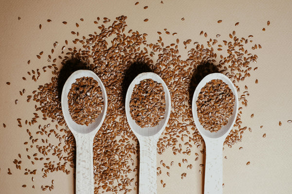 flax seeds on three spoons