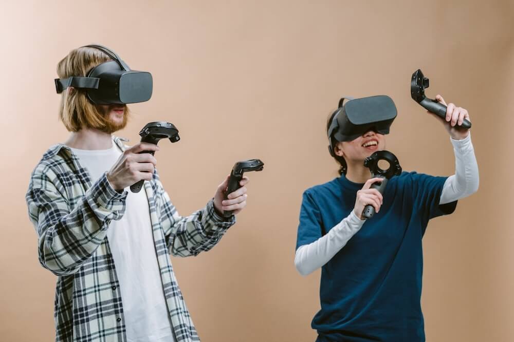Couple enjoying a VR game together. Photo by Tima Miroshnichenko.