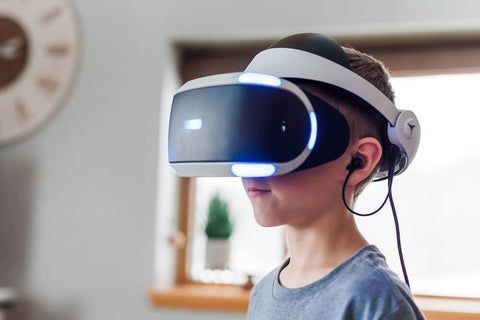 Kid playing VR, one of the easier indoor activities for kids. Photo by Jessica Lewis 🦋 thepaintedsquare.