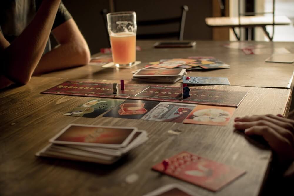 Playing board games at a board game cafe. Photo by Egidijus Bielskis.