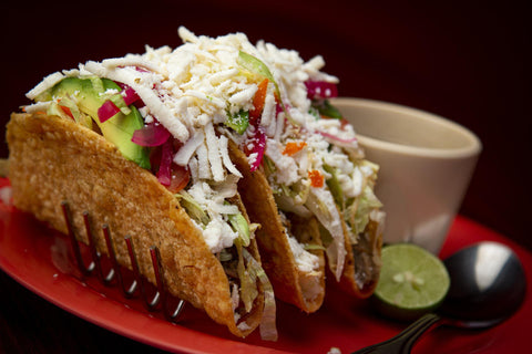 Grilled Fish Tacos served with lemon and grated cottage cheese