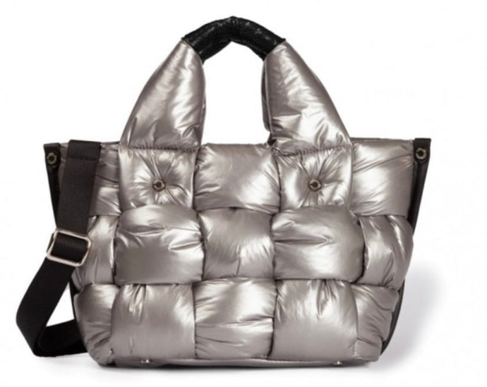 top handle silver woven puffer bag with adjustable fabric shoulder strap and stainless metal details. This medium size bag is roomy enough without being too big.