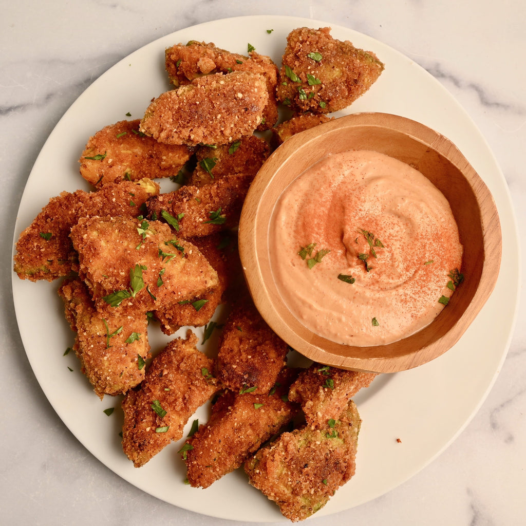 A close up of fried avocado fries