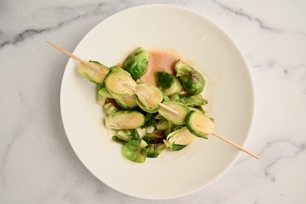 Raw Brussels sprouts on skewers