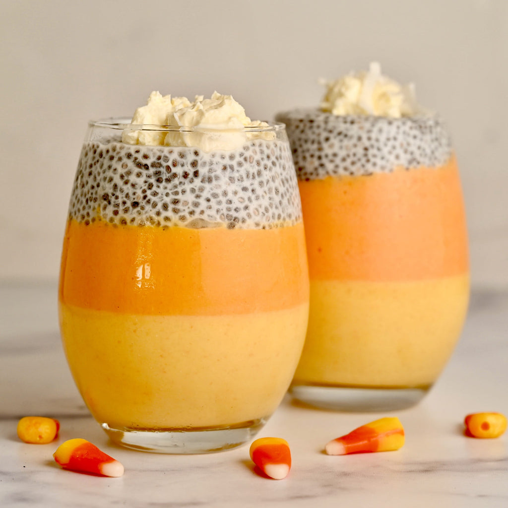 Candy corn chia pudding in a clear glass