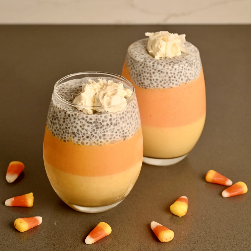 Candy corn chia seed pudding in a clear glass