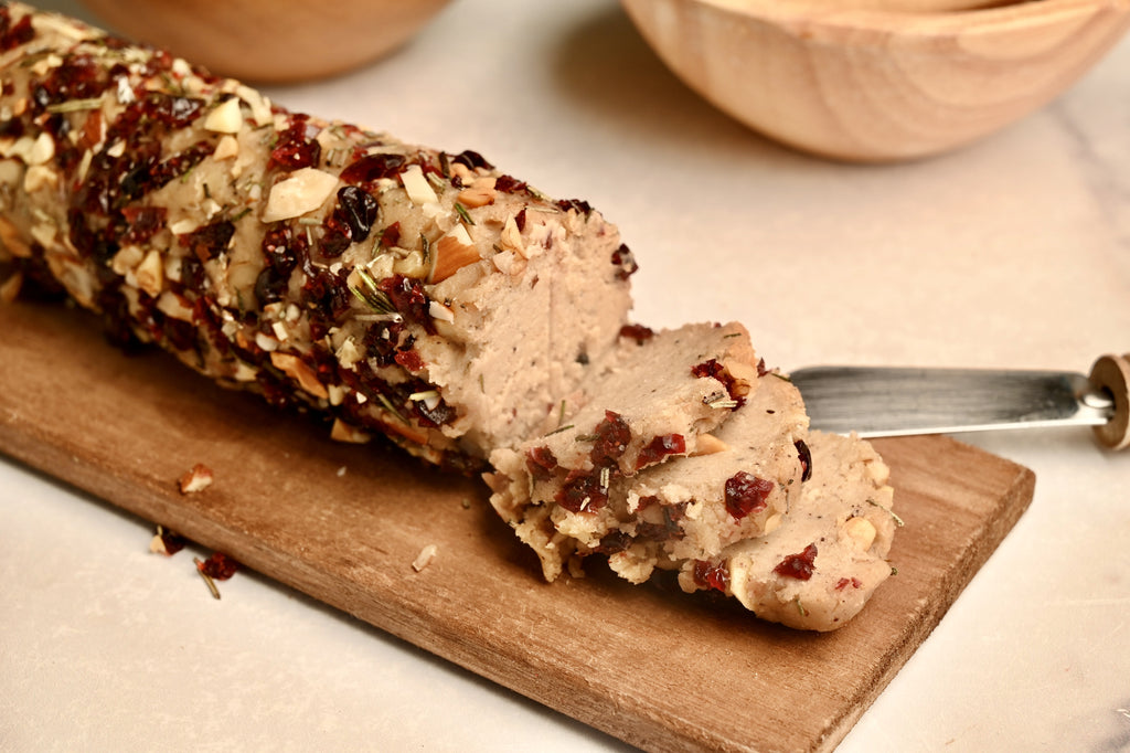 A close up of a plant based cheese log