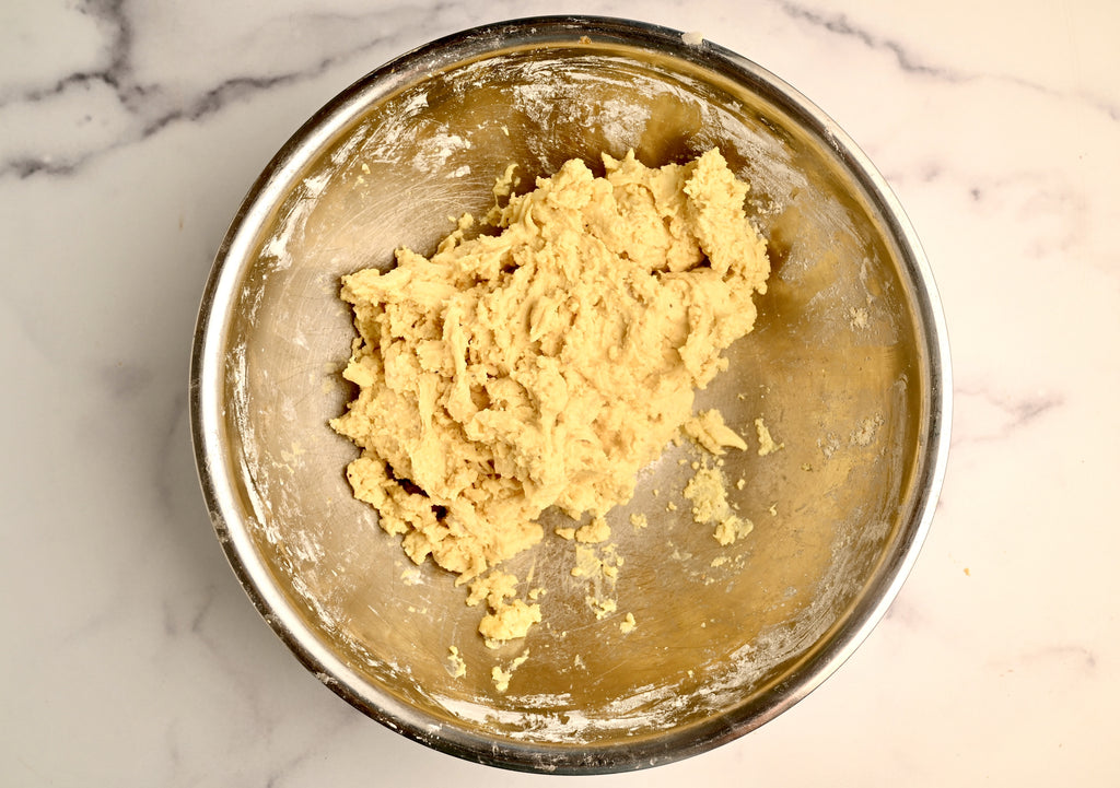 Raw dough in a mixing bowl