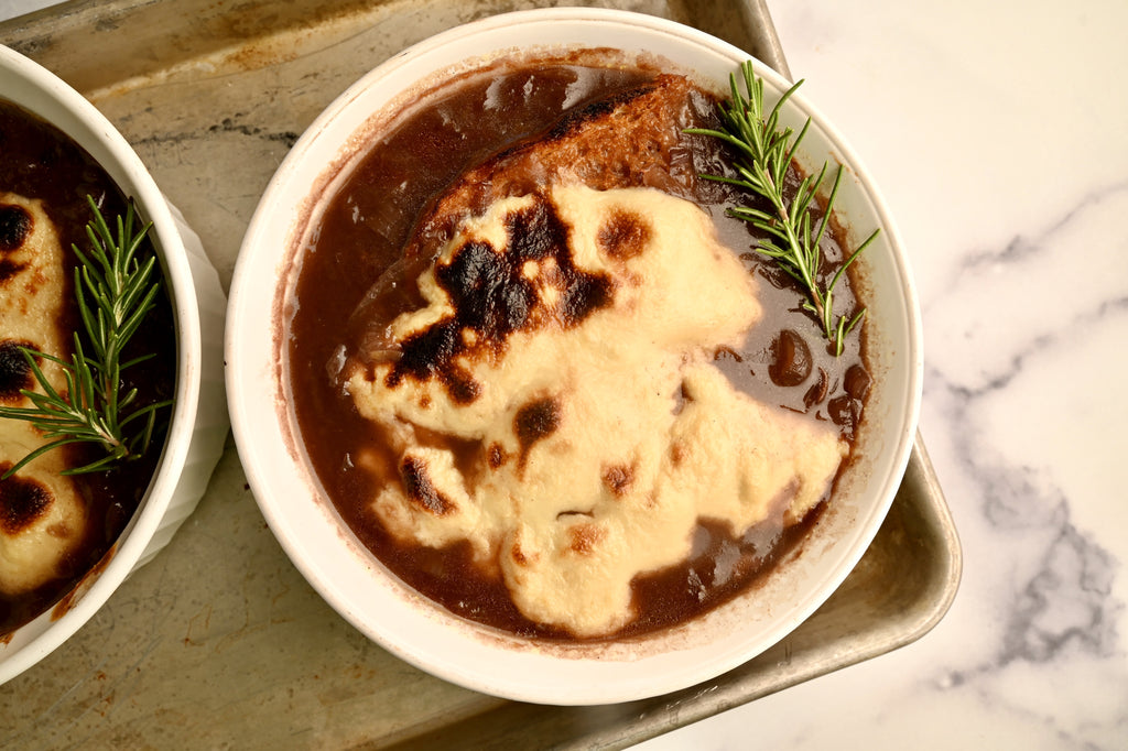 A close up of a bowl of French onion soup