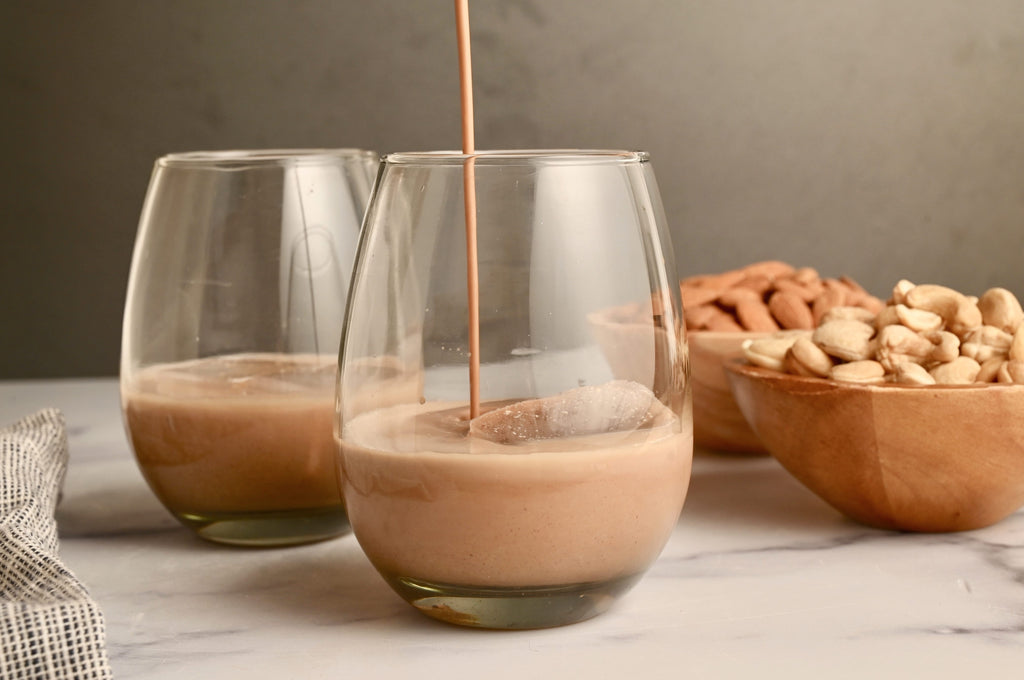 Dairy-free Irish coffee being poured into a short glass