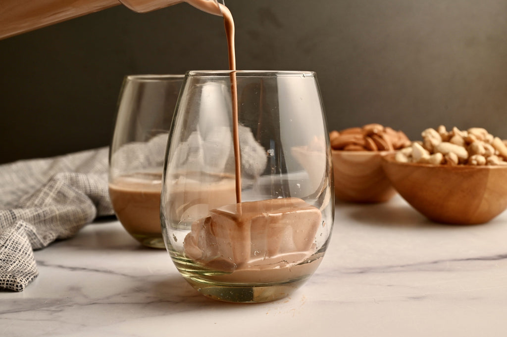 Dairy-free Irish coffee being poured into a short glass