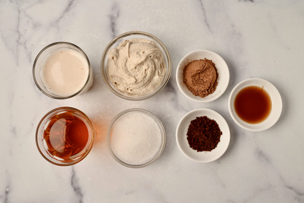 An overview shot of coffee ingredients on a marble countertop